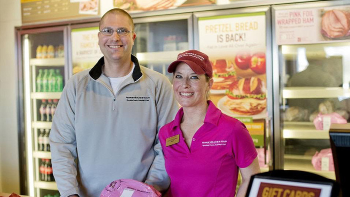 Female and male HoneyBaked franchisees