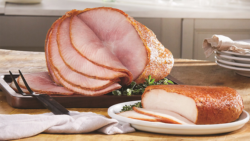 A Thanksgiving franchise feast with a bone-in half ham and roast turkey.