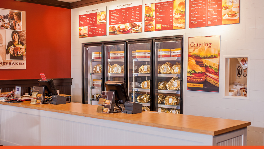 Image of interior Honey Baked Ham franchise store counter and menu signs