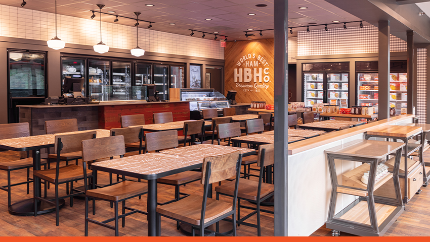 Image of interior Honey Baked Ham franchise restaurant with tables and chairs